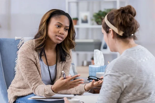 Individual therapy session during substance abuse treatment near Galloway and Absecon, New Jersey. Healthcare specialist answers the question will insurance cover rehab for drug or alcohol addiction