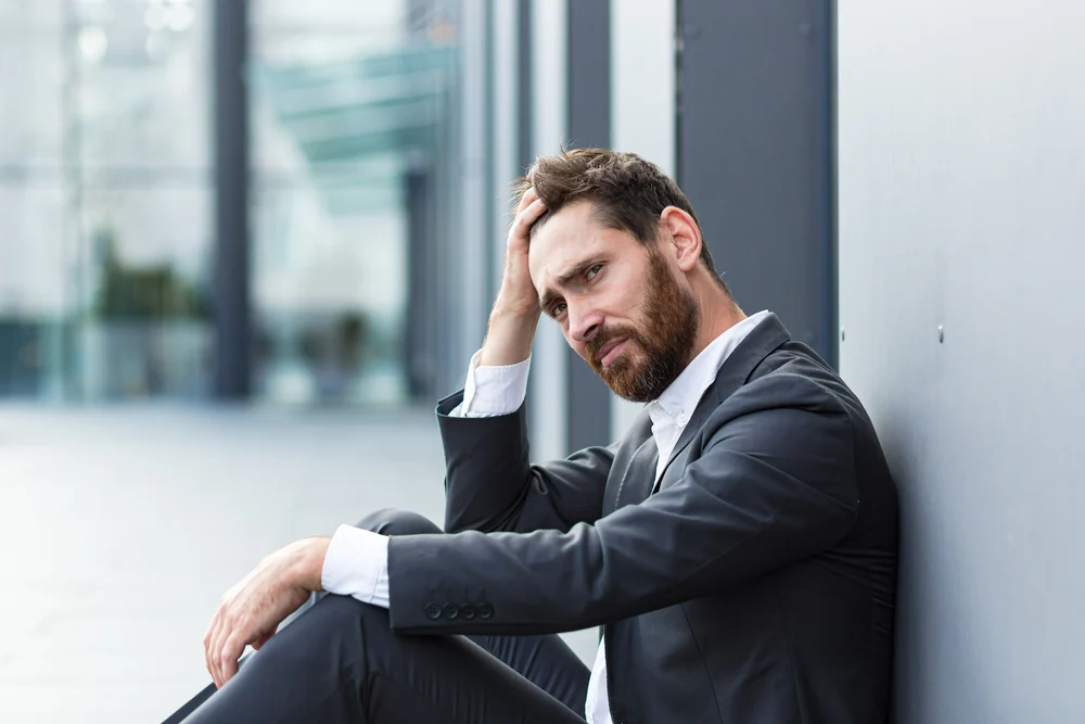 A male executive engages in drug misuse as a result of untreated mental health issues